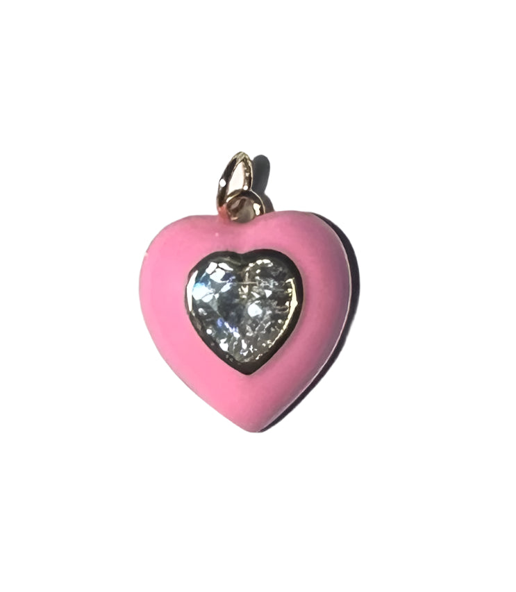 Dije en forma de corazon rosado con circon en centro