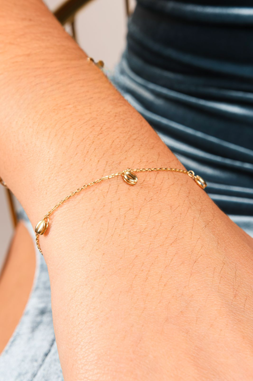 Pulsera de Oro de 10k con dijes ovalados