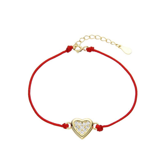 Pulsera de hilo rojo con dije de corazón en plata bañado en oro amarillo